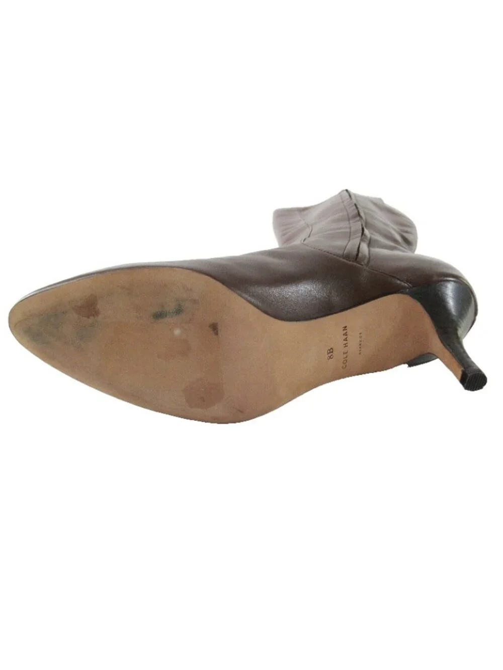Cole Haan boots shown